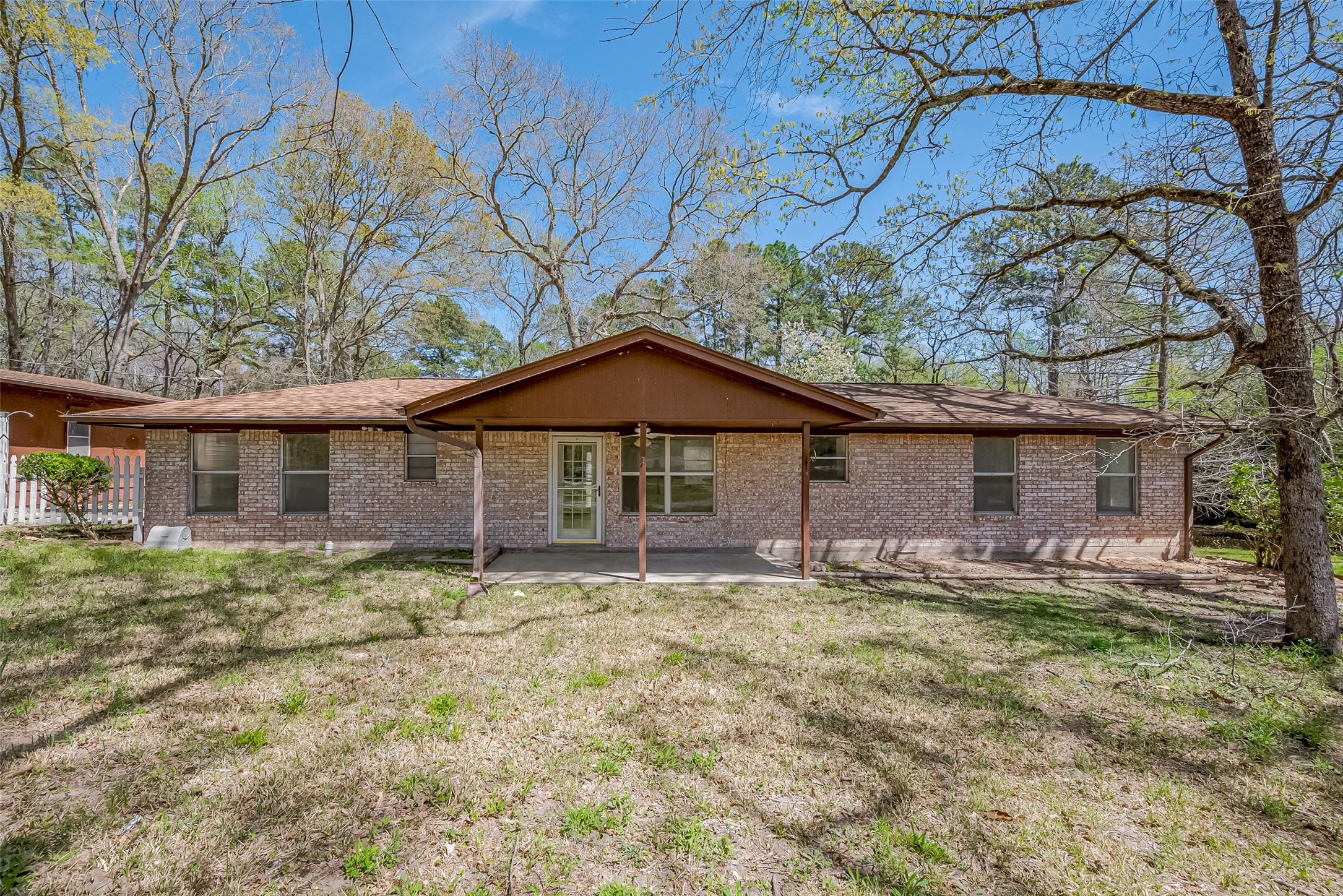 14 Veronica Lane Huntsville, TX 77340 - Photo 1 of 50 a house that has a tree in front of it