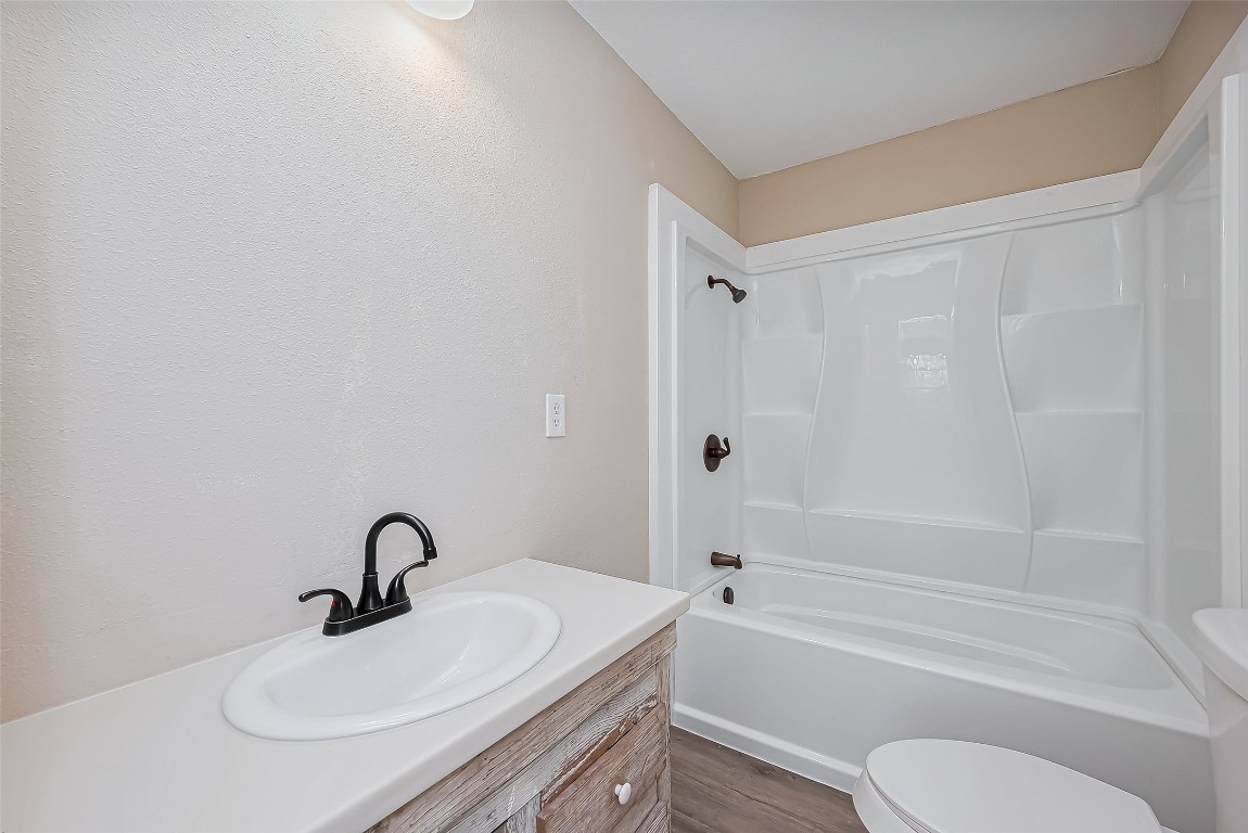 14 Veronica Lane Huntsville, TX 77340 - Photo 20 of 50 a bathroom with a sink toilet a bathtub and shower