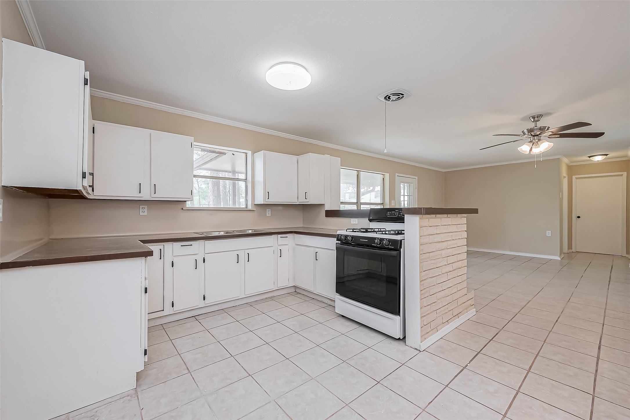 14 Veronica Lane Huntsville, TX 77340 - Photo 8 of 50 a kitchen with stainless steel appliances granite countertop a stove and a sink
