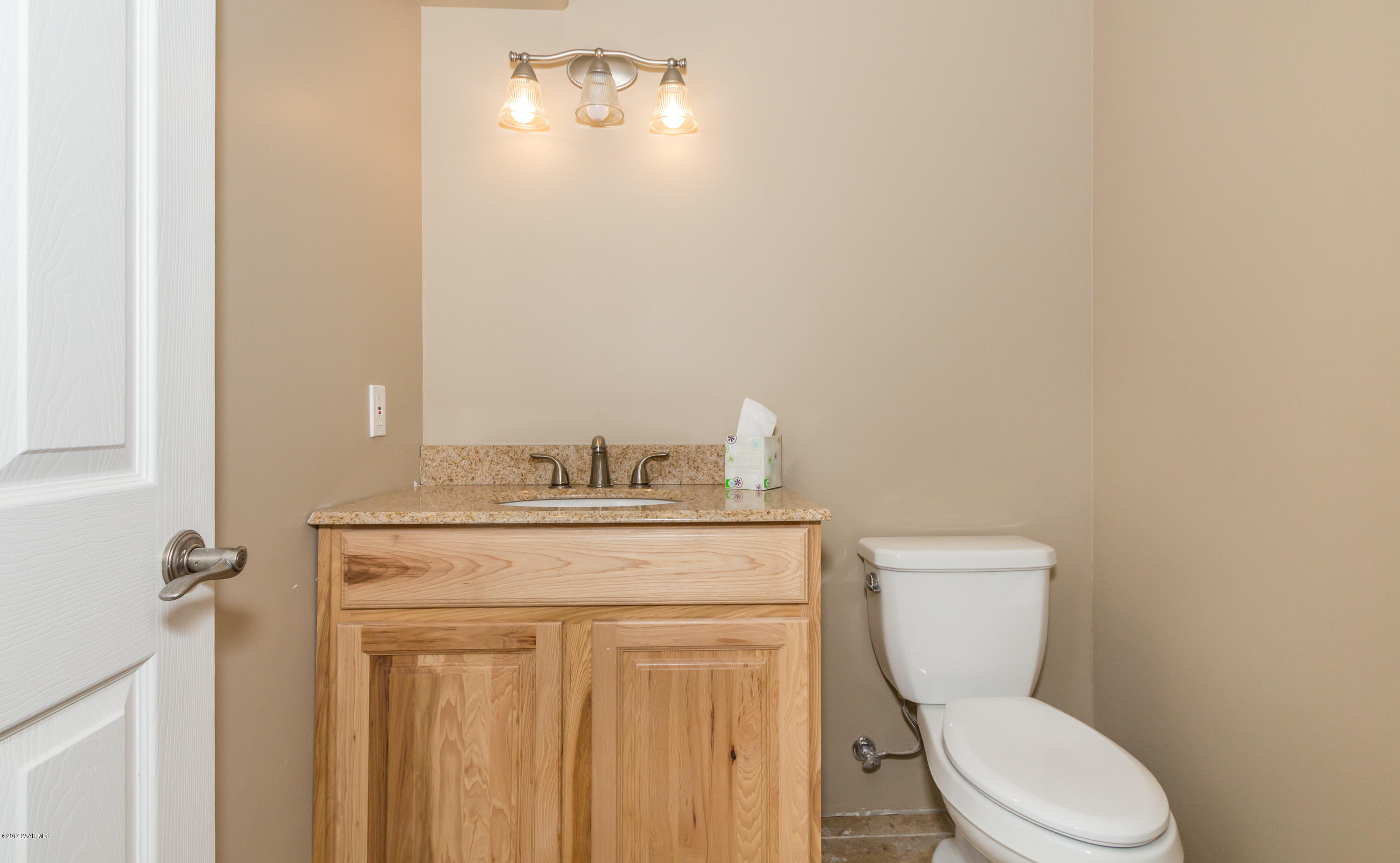 8000 Dillon Wash Road Prescott, AZ 86305 - Photo 12 of 23 a white toilet sitting next to a bathroom sink