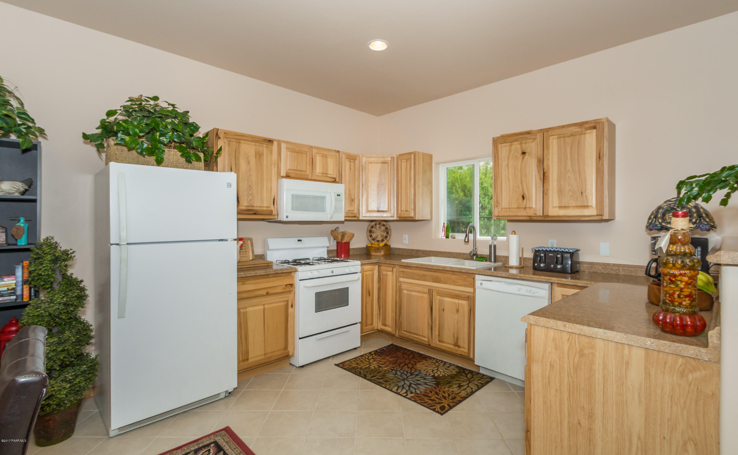 8000 Dillon Wash Road Prescott, AZ 86305 - Photo 18 of 23 a kitchen with a refrigerator a stove top oven a sink and dishwasher