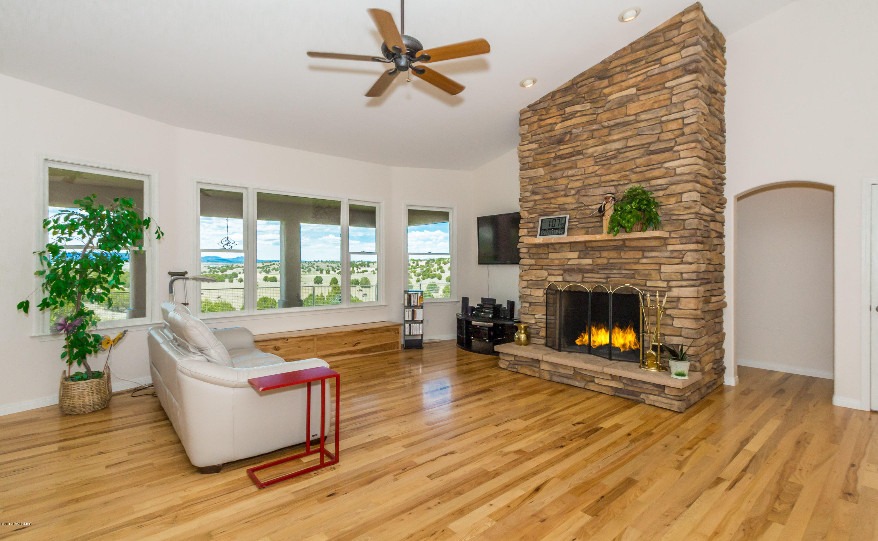 8000 Dillon Wash Road Prescott, AZ 86305 - Photo 2 of 23 a living room with furniture and a fireplace