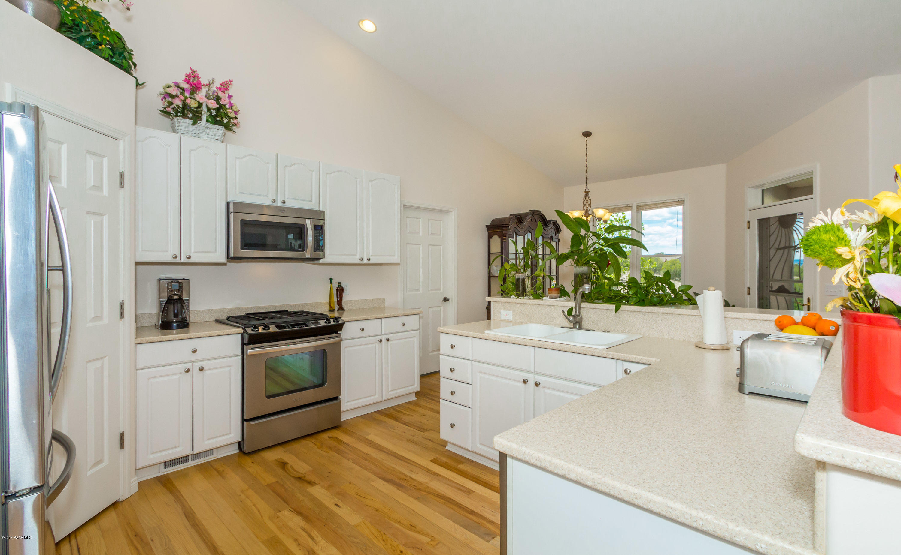 8000 Dillon Wash Road Prescott, AZ 86305 - Photo 5 of 23 a kitchen with a sink stove and refrigerator