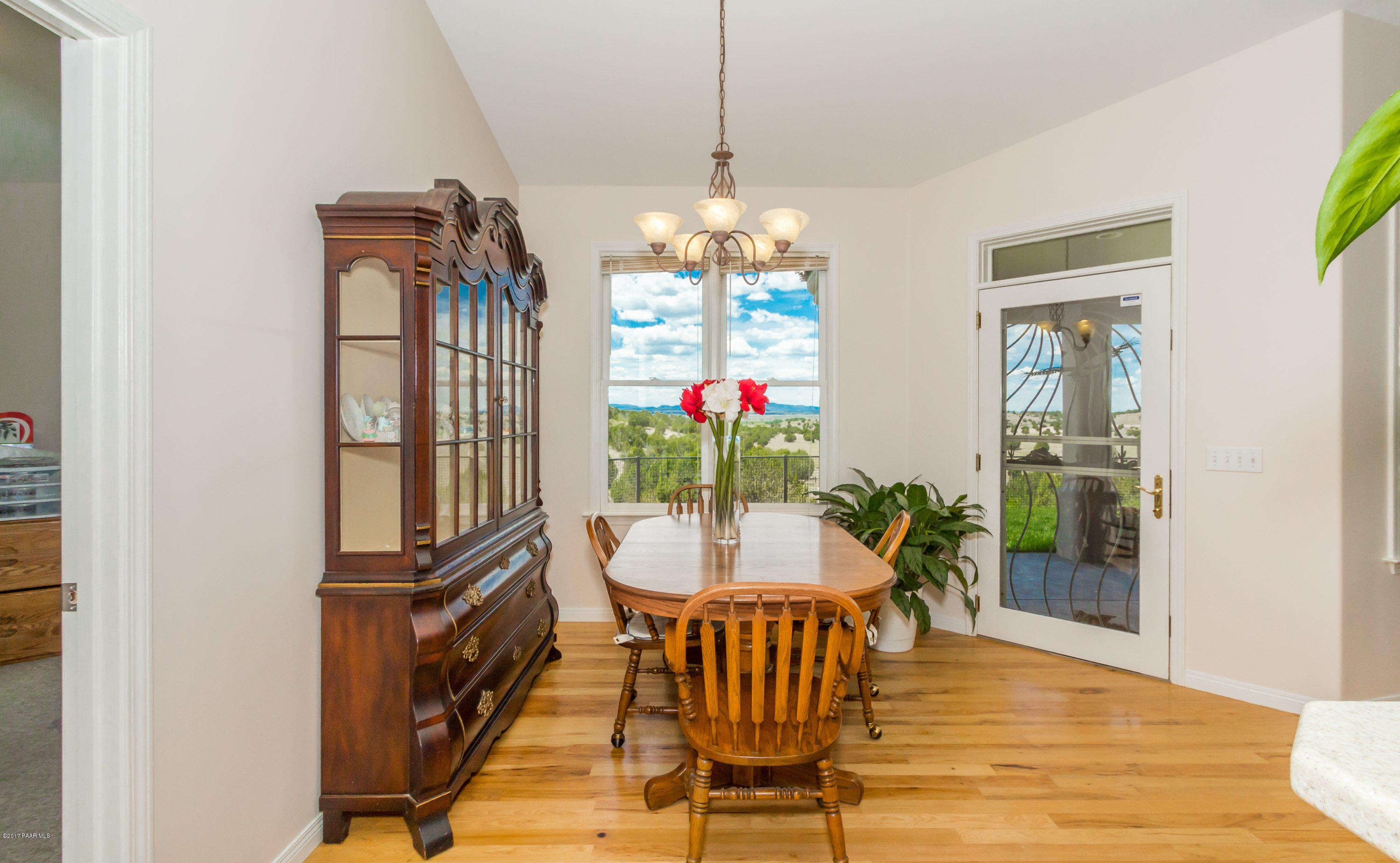 8000 Dillon Wash Road Prescott, AZ 86305 - Photo 6 of 23 a view of a dining room with furniture window and wooden floor