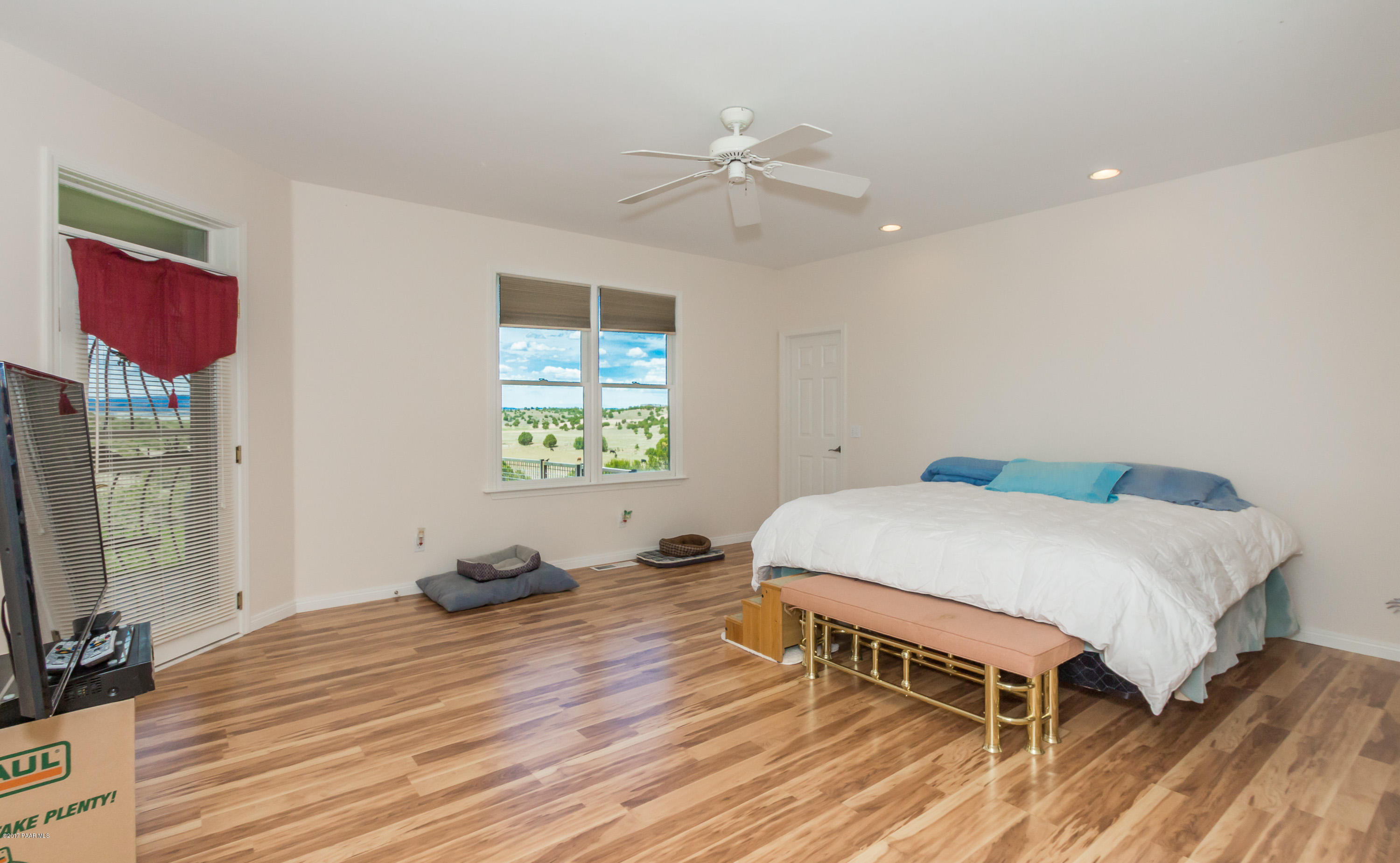8000 Dillon Wash Road Prescott, AZ 86305 - Photo 8 of 23 a bedroom with a bed and a flat screen tv
