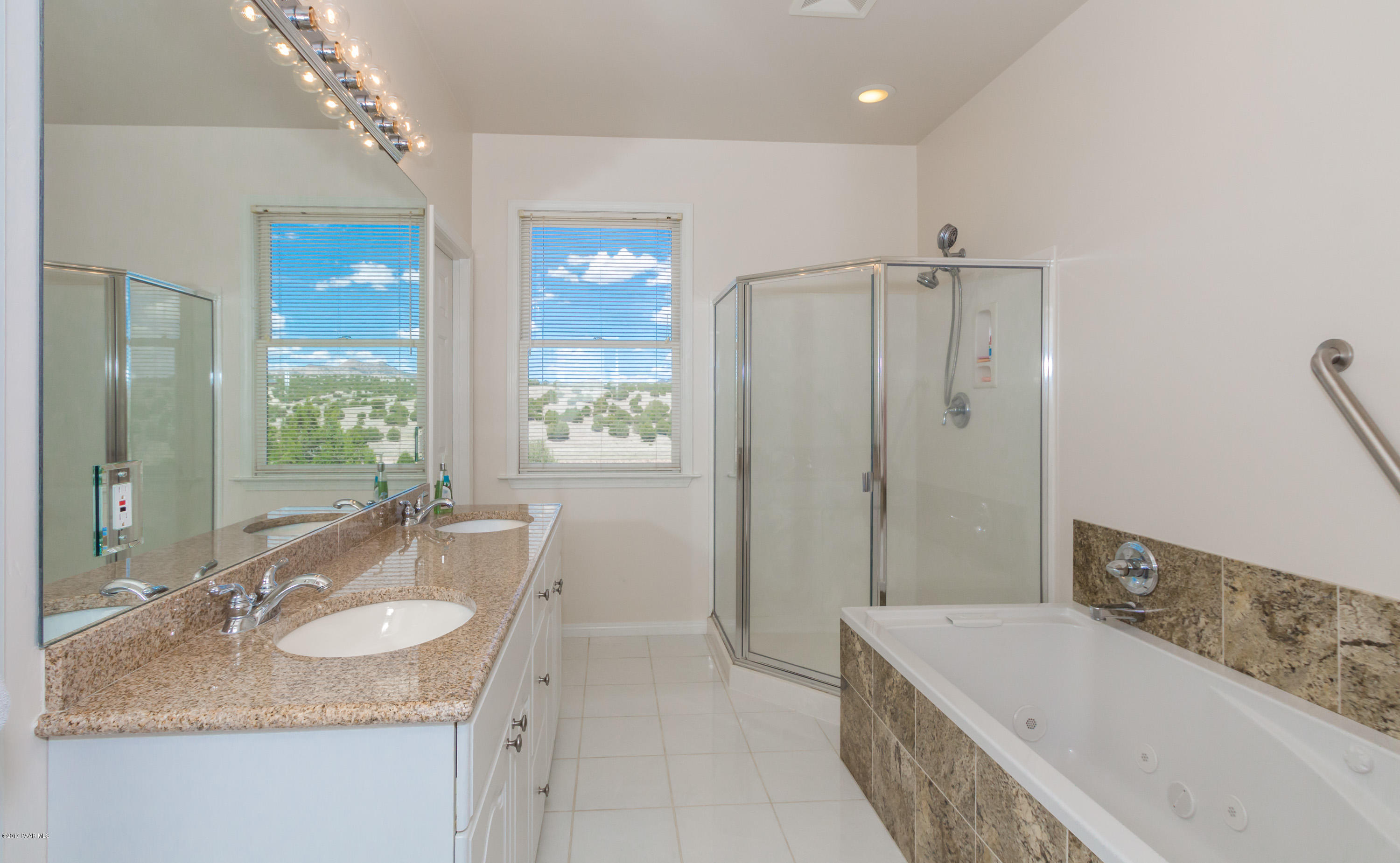 8000 Dillon Wash Road Prescott, AZ 86305 - Photo 9 of 23 a bathroom with a granite countertop tub sink and mirror