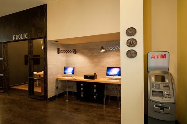 a kitchen with stainless steel appliances kitchen island granite countertop a refrigerator and a stove