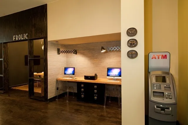 a kitchen with stainless steel appliances kitchen island granite countertop a refrigerator and a stove