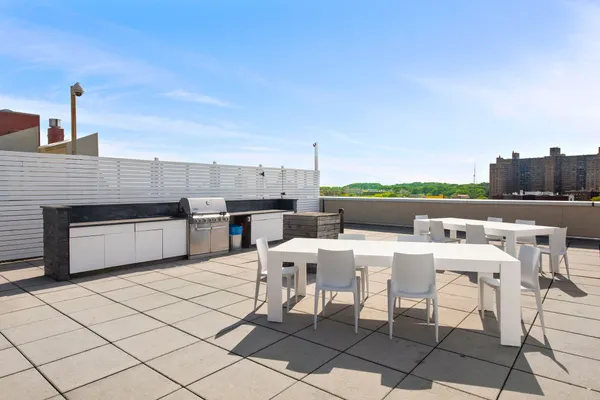 a dinning table and chairs in the terrace