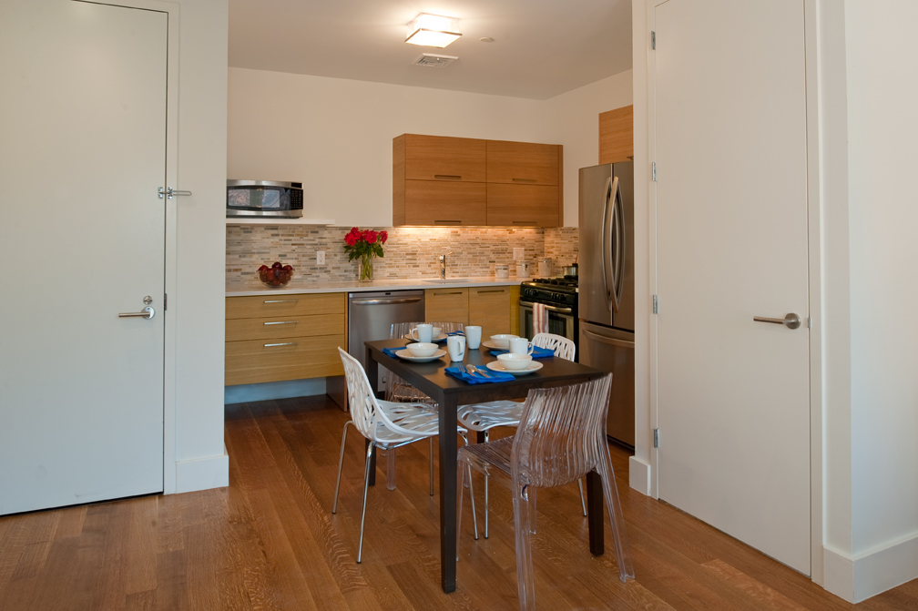 301 Sullivan Place, Unit 4Q Brooklyn, NY 11225 - Photo 2 of 27 a kitchen with stainless steel appliances granite countertop a sink and a refrigerator