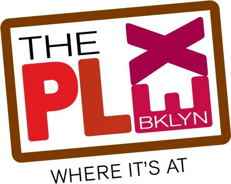 a front view of a building with lot of cars and trees