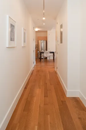 a view of a living room with a wooden floor