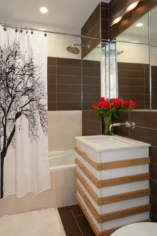 a bathroom with a bathtub and a shower