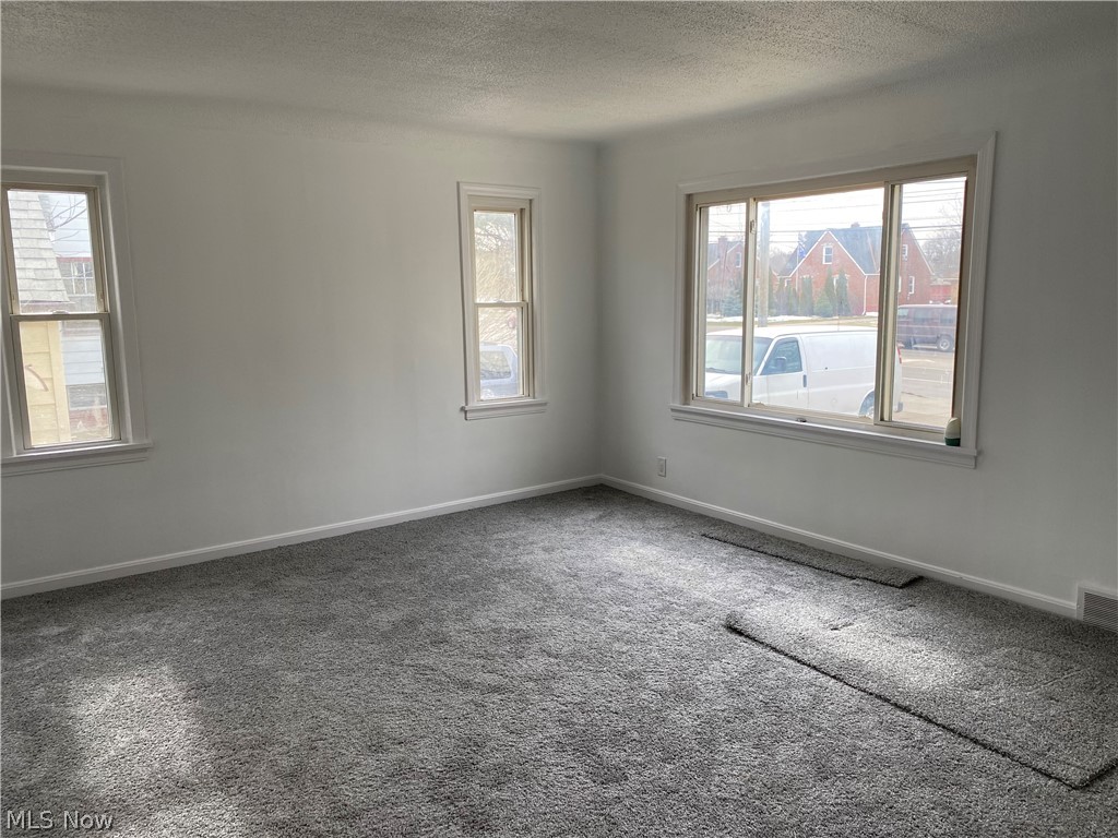 6367 Stumph Road Cleveland, OH 44130 - Photo 7 of 30 Large living room with new carpeting throughout the home
