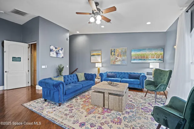 a living room with furniture rug and window