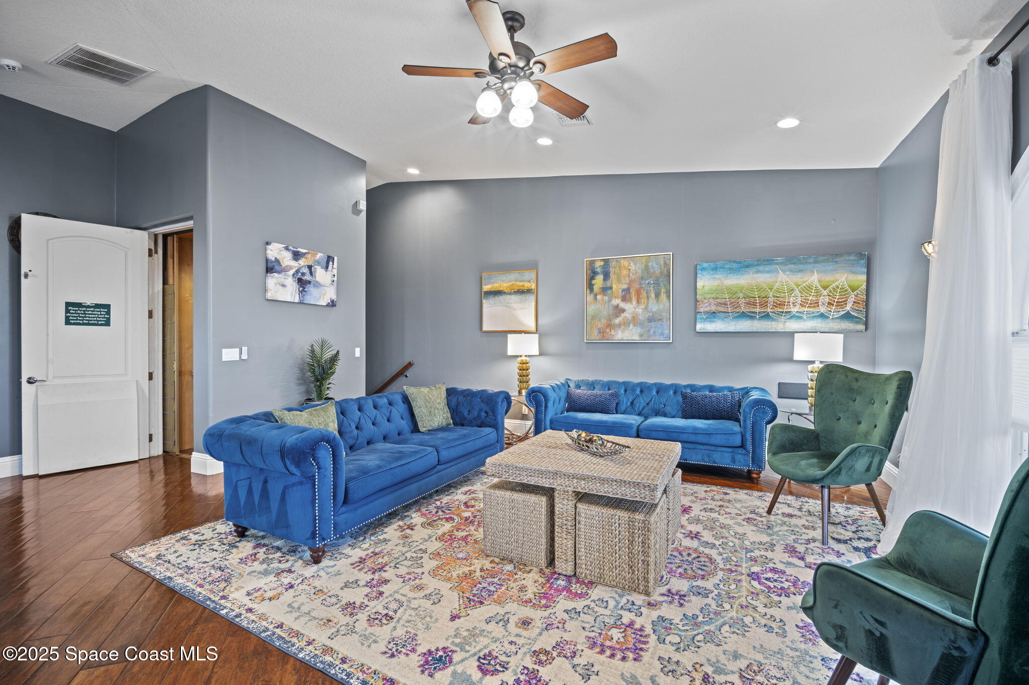 a living room with furniture rug and window
