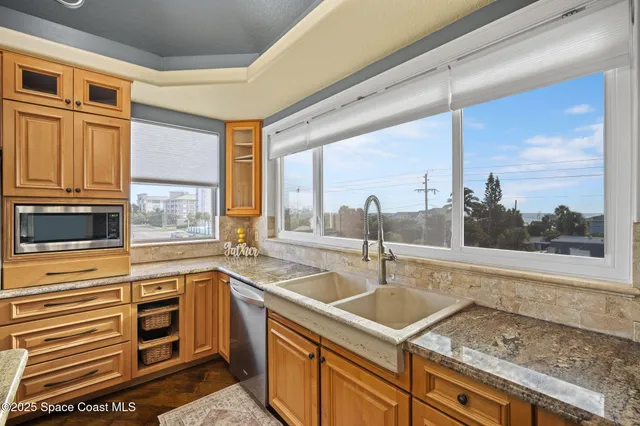 a kitchen with a sink and a window
