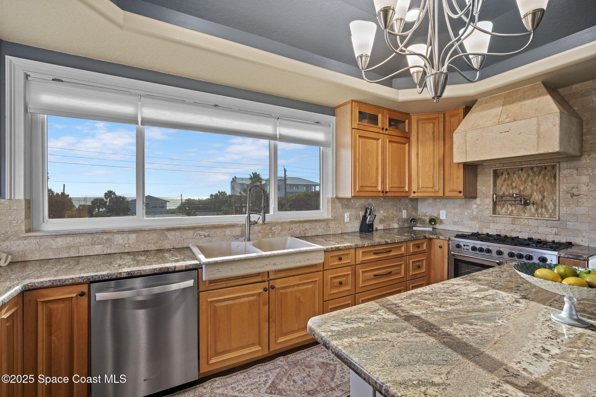 2694 South Atlantic Avenue Cocoa Beach, FL 32931 - Photo 14 of 72 a kitchen with stainless steel appliances granite countertop a sink a stove and a wooden floors