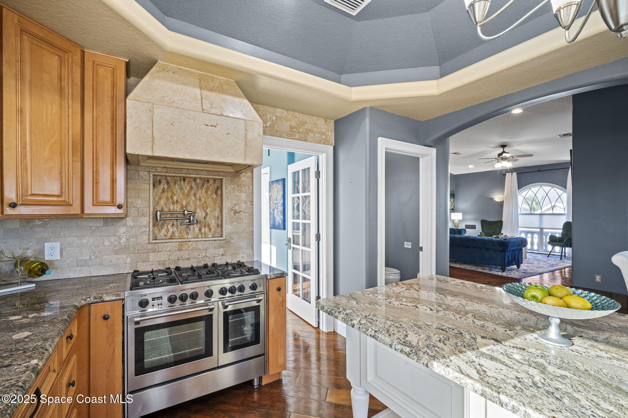 2694 South Atlantic Avenue Cocoa Beach, FL 32931 - Photo 16 of 72 a kitchen with stainless steel appliances granite countertop a stove and a cabinets