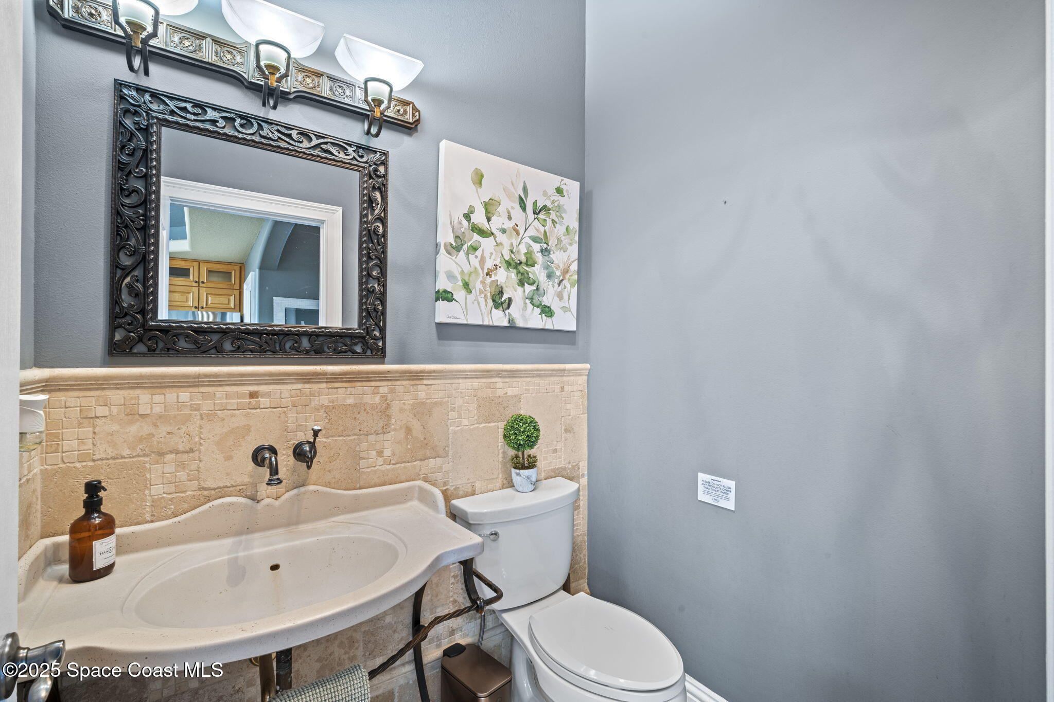 2694 South Atlantic Avenue Cocoa Beach, FL 32931 - Photo 19 of 72 a bathroom with a sink and a mirror
