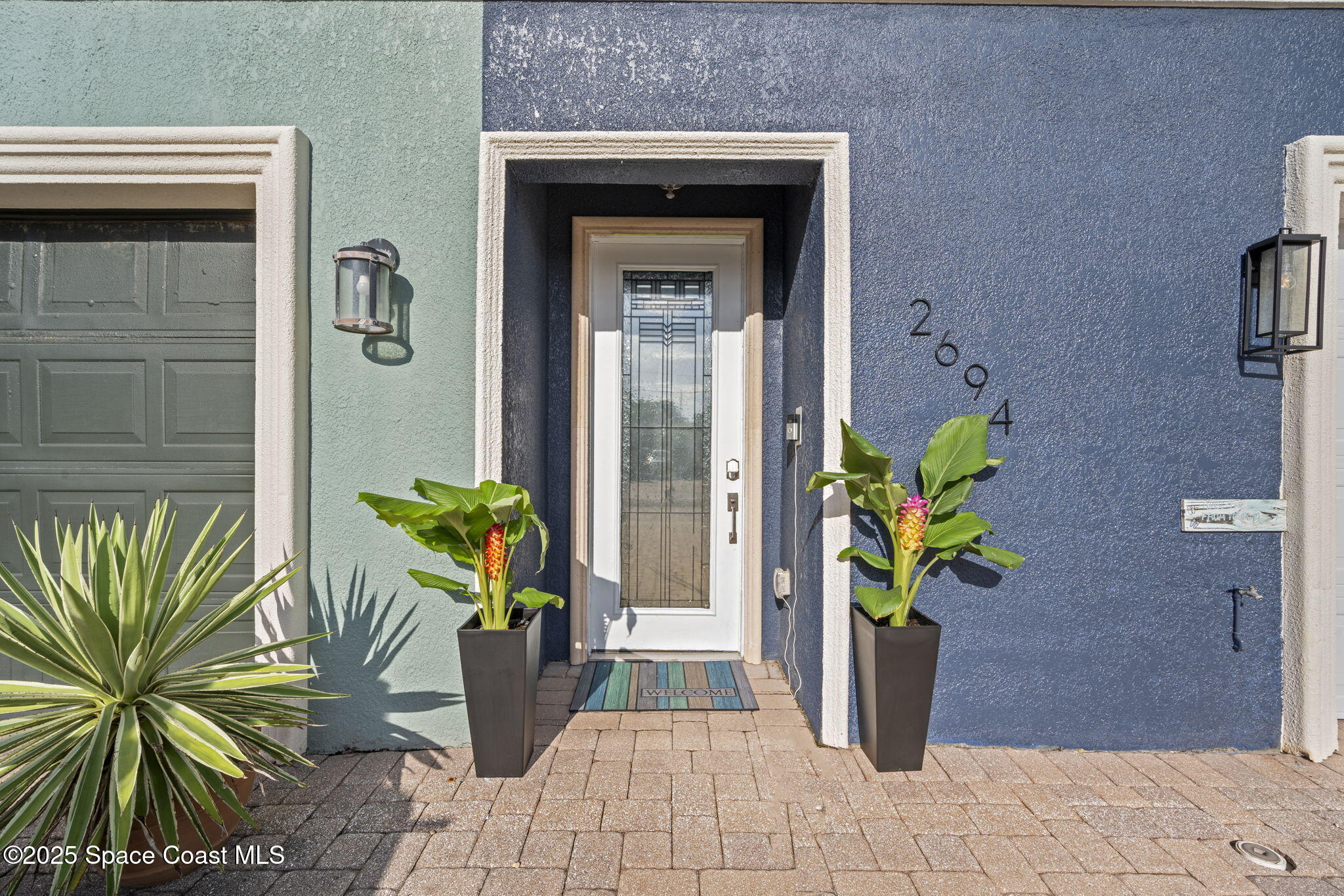 2694 South Atlantic Avenue Cocoa Beach, FL 32931 - Photo 2 of 72 a view of a entryway door of the house