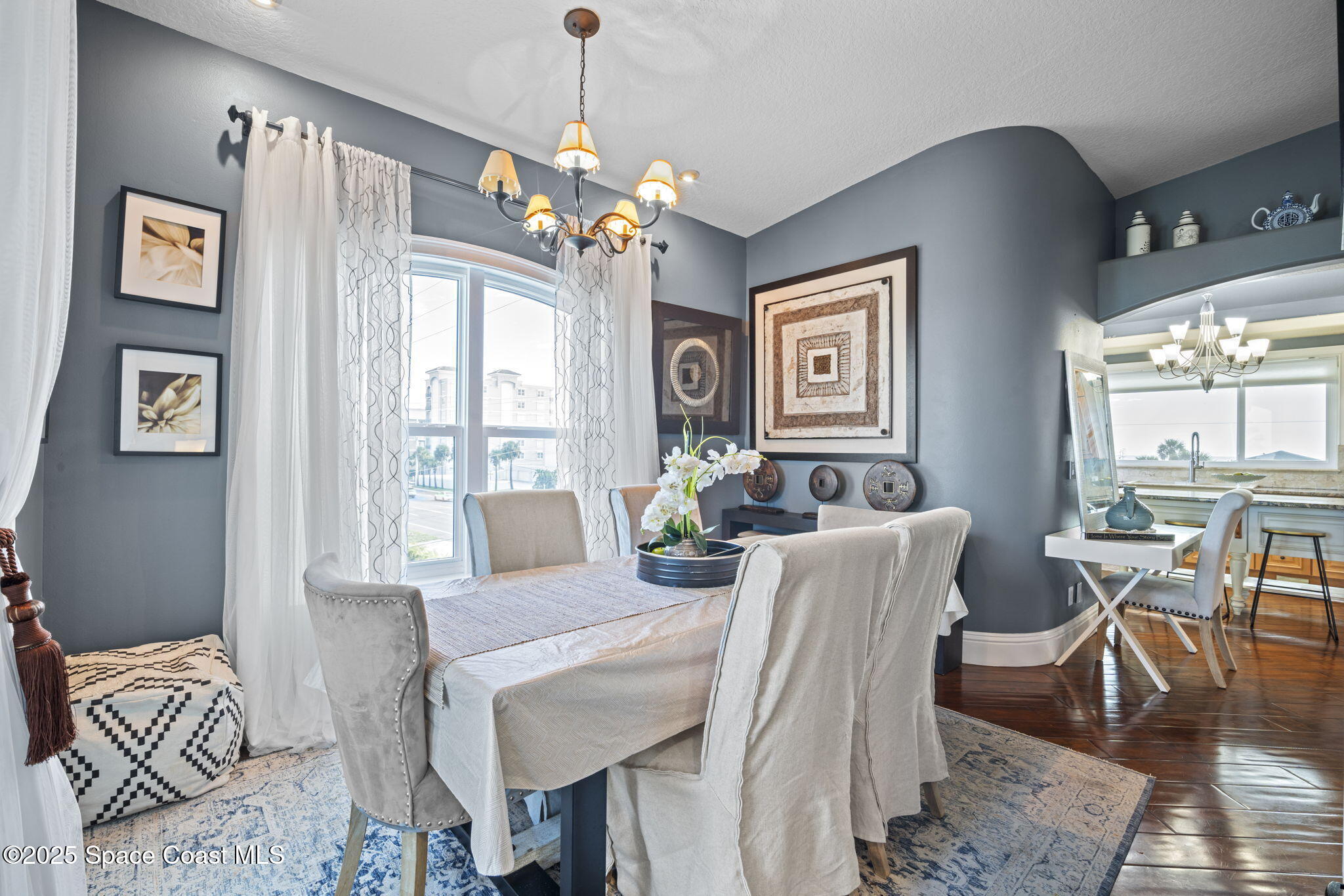 2694 South Atlantic Avenue Cocoa Beach, FL 32931 - Photo 21 of 72 a view of a dining room with furniture window and wooden floor