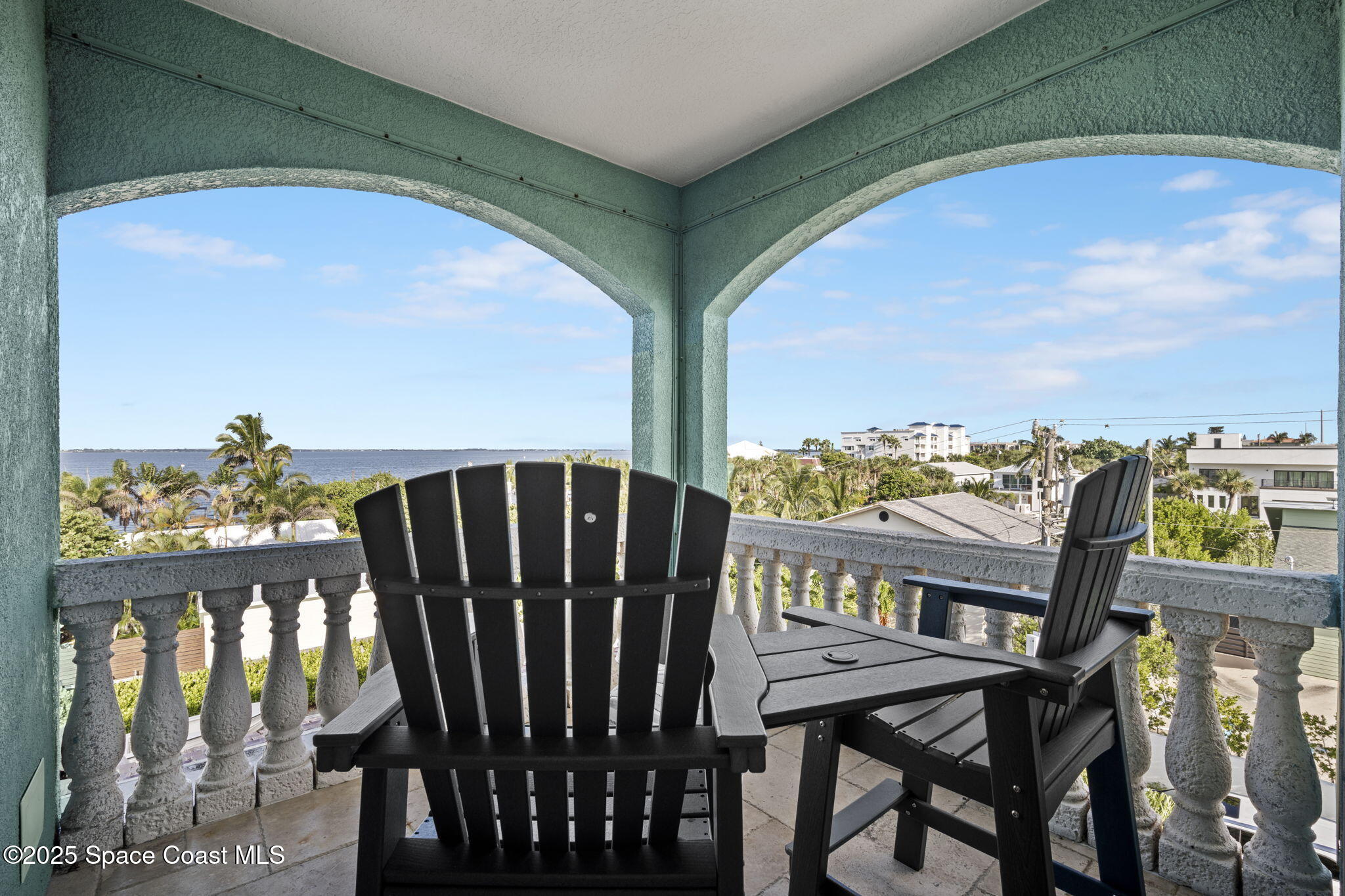 2694 South Atlantic Avenue Cocoa Beach, FL 32931 - Photo 23 of 72 a view of a balcony with furniture