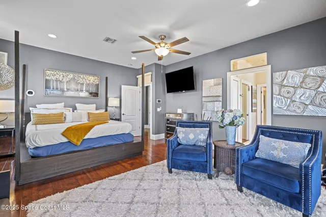 a bedroom with a bed and a couch