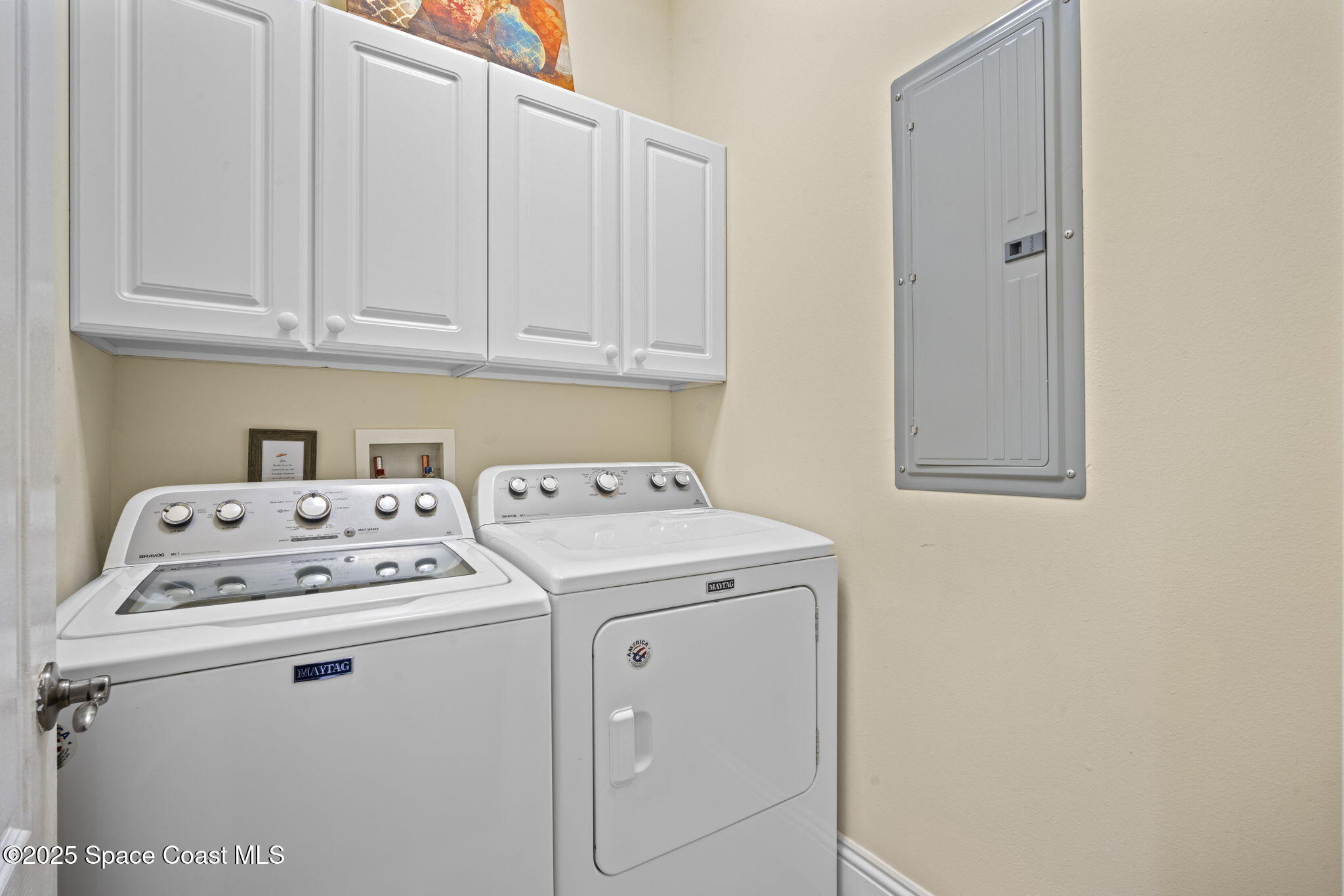 2694 South Atlantic Avenue Cocoa Beach, FL 32931 - Photo 32 of 72 a utility room with dryer and washer