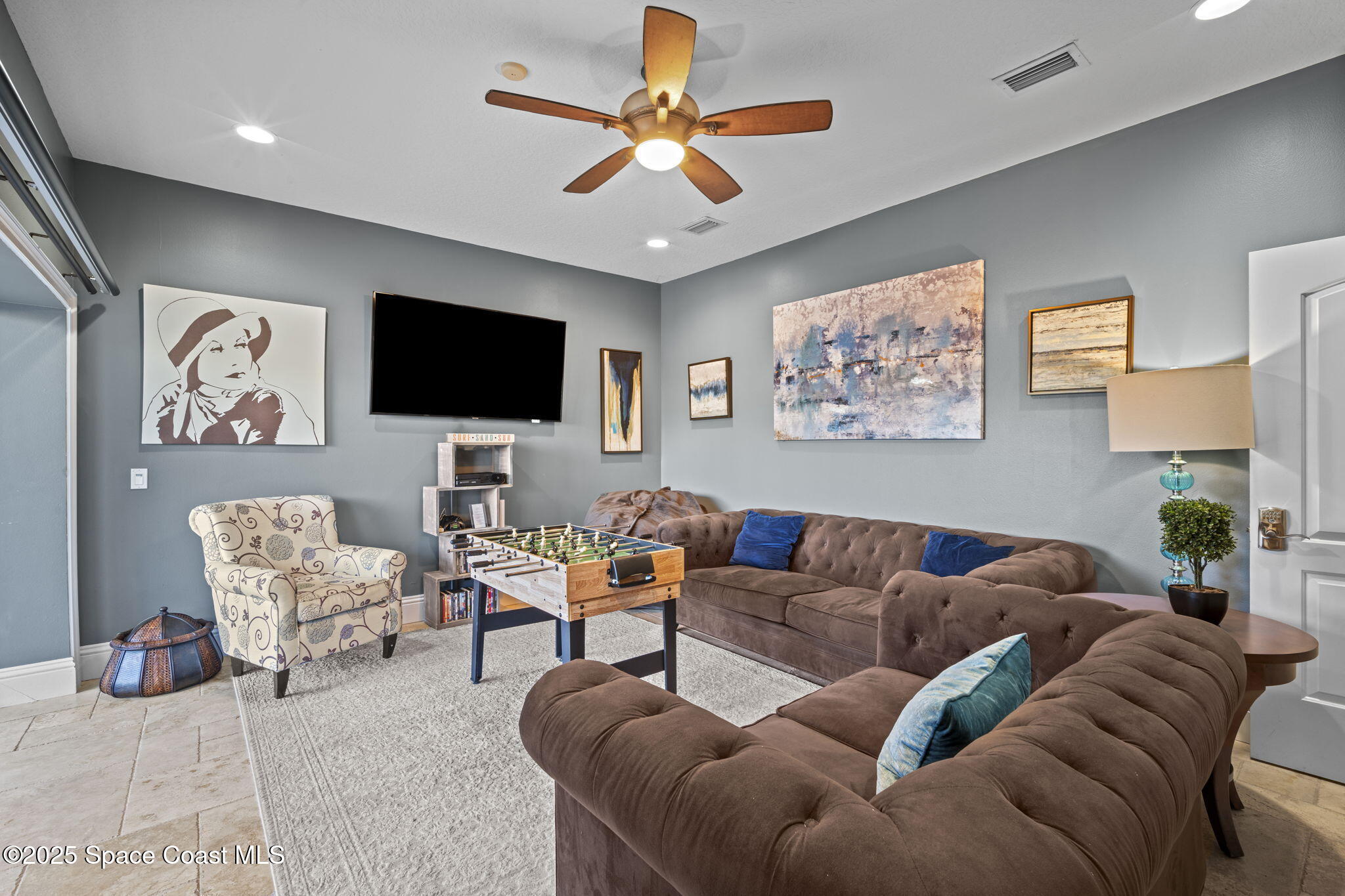 2694 South Atlantic Avenue Cocoa Beach, FL 32931 - Photo 41 of 72 a living room with furniture and a flat screen tv