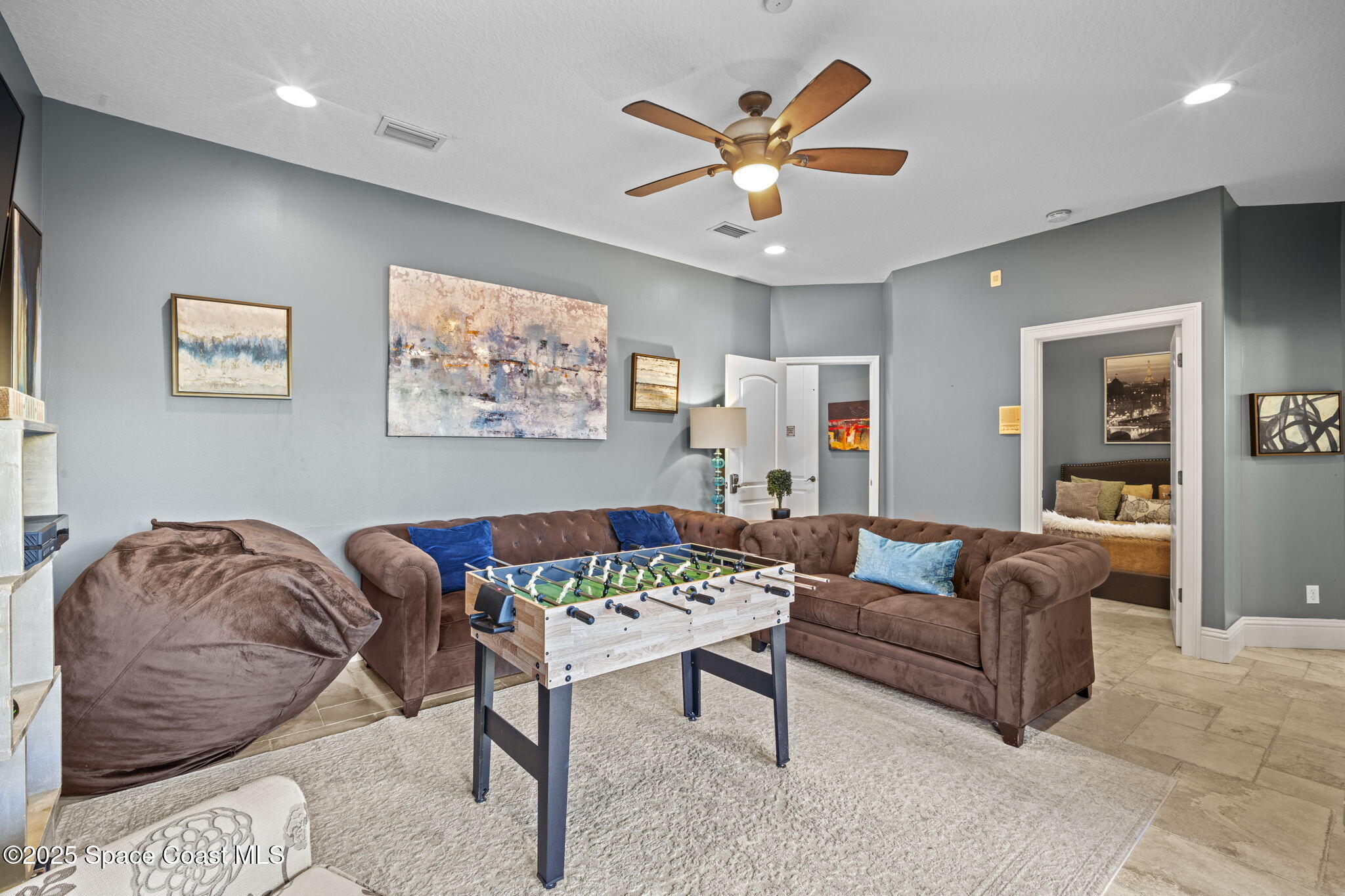 2694 South Atlantic Avenue Cocoa Beach, FL 32931 - Photo 42 of 72 a living room with furniture and a large window