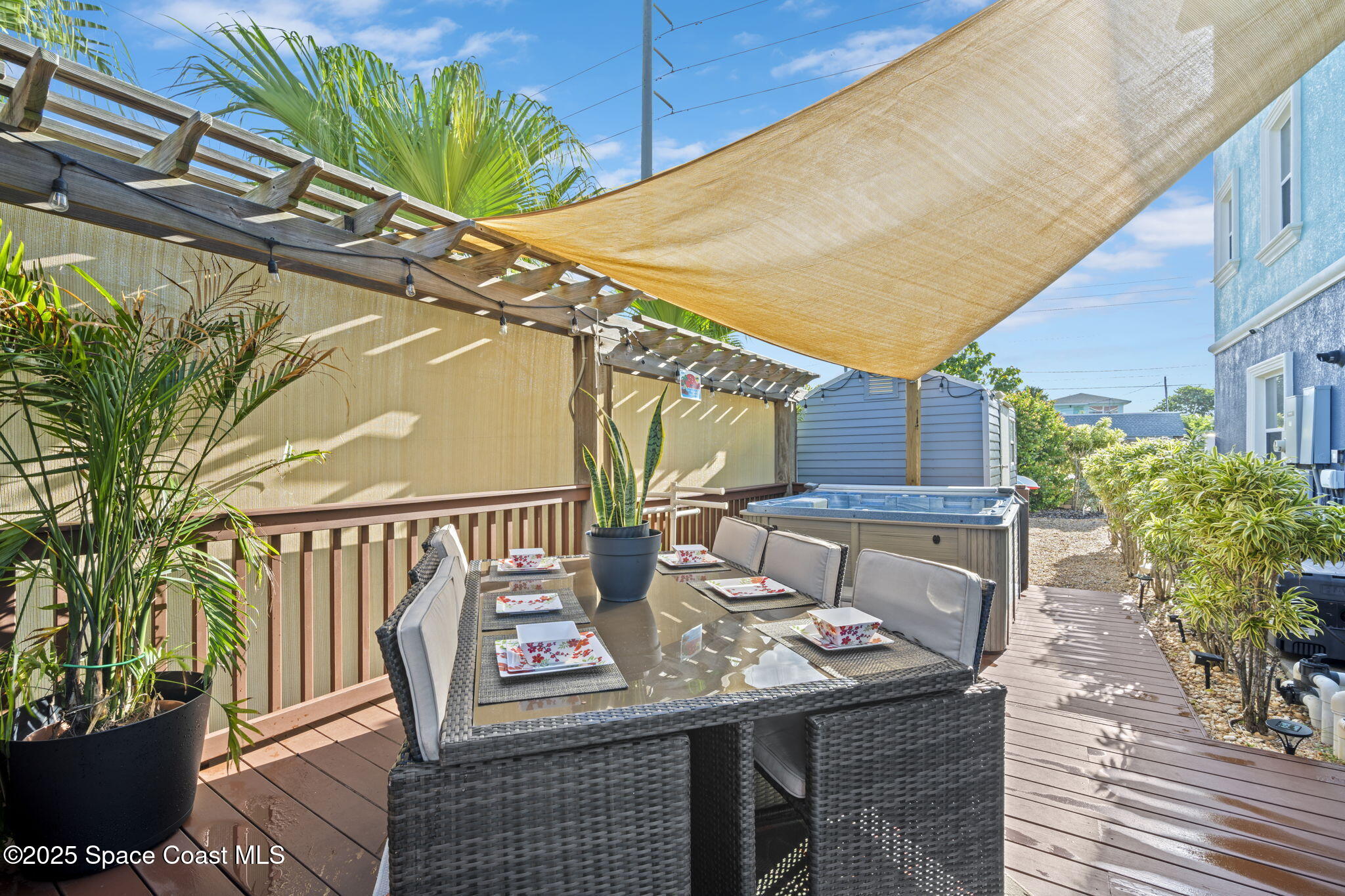 2694 South Atlantic Avenue Cocoa Beach, FL 32931 - Photo 54 of 72 a view of a chairs and table in the patio