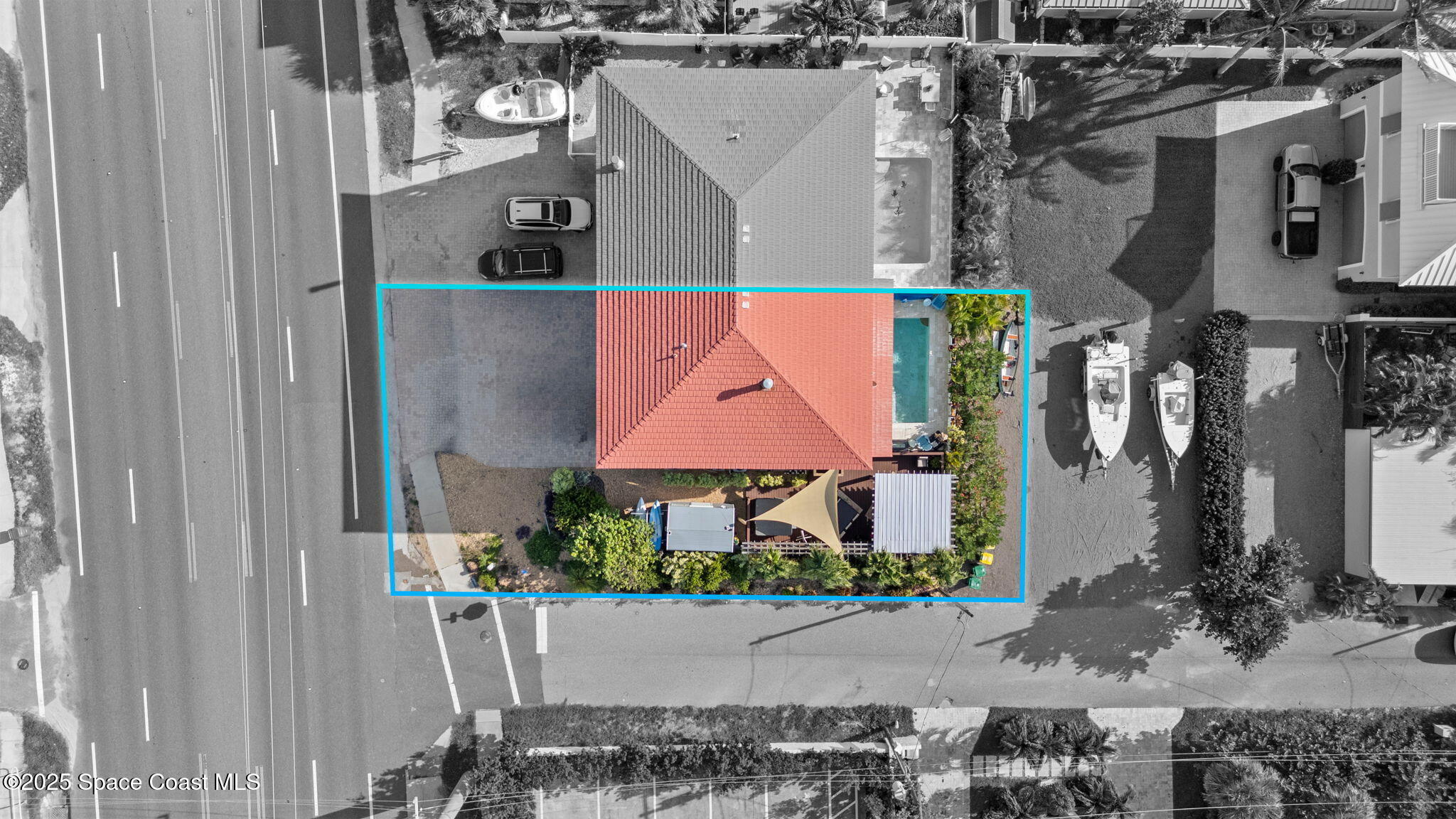 2694 South Atlantic Avenue Cocoa Beach, FL 32931 - Photo 56 of 72 a aerial view of a house with a yard and a bench