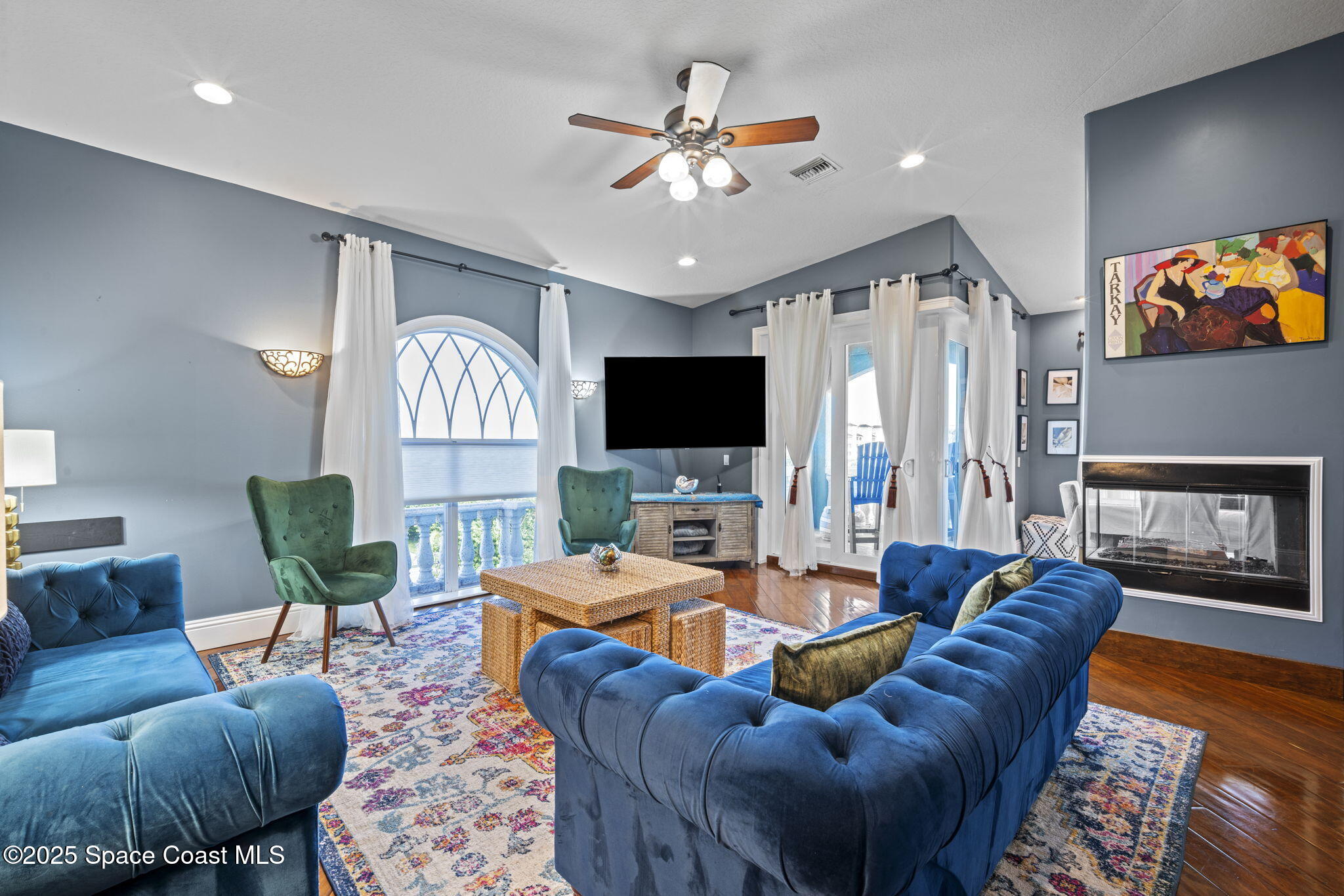 2694 South Atlantic Avenue Cocoa Beach, FL 32931 - Photo 8 of 72 a living room with furniture and a flat screen tv