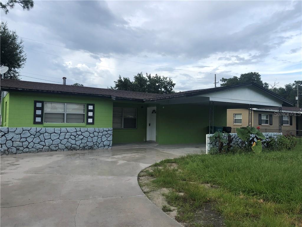4113 Kalwit Lane Orlando, FL 32808 - Photo 1 of 1 a front view of a house with garden