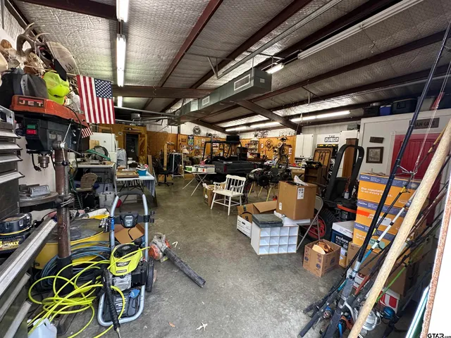 a bathroom with a toilet a sink and shower