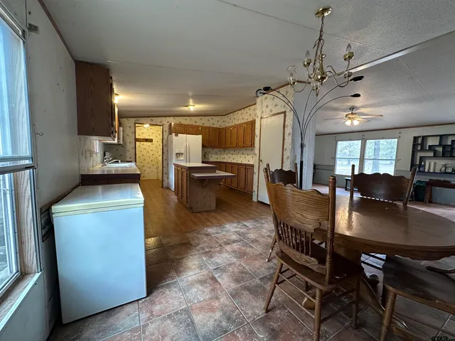 a room with hard wood floors and a mirror