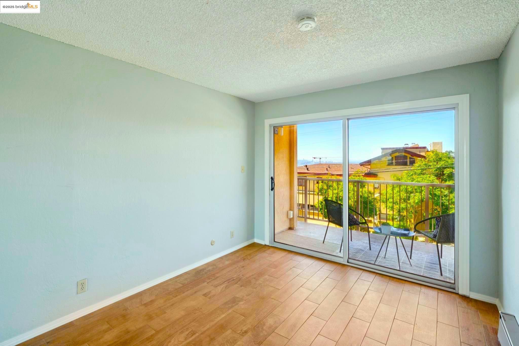 2 Panoramic Way, Unit 105 Berkeley, CA 94704 - Photo 14 of 20 an empty room with sliding glass door
