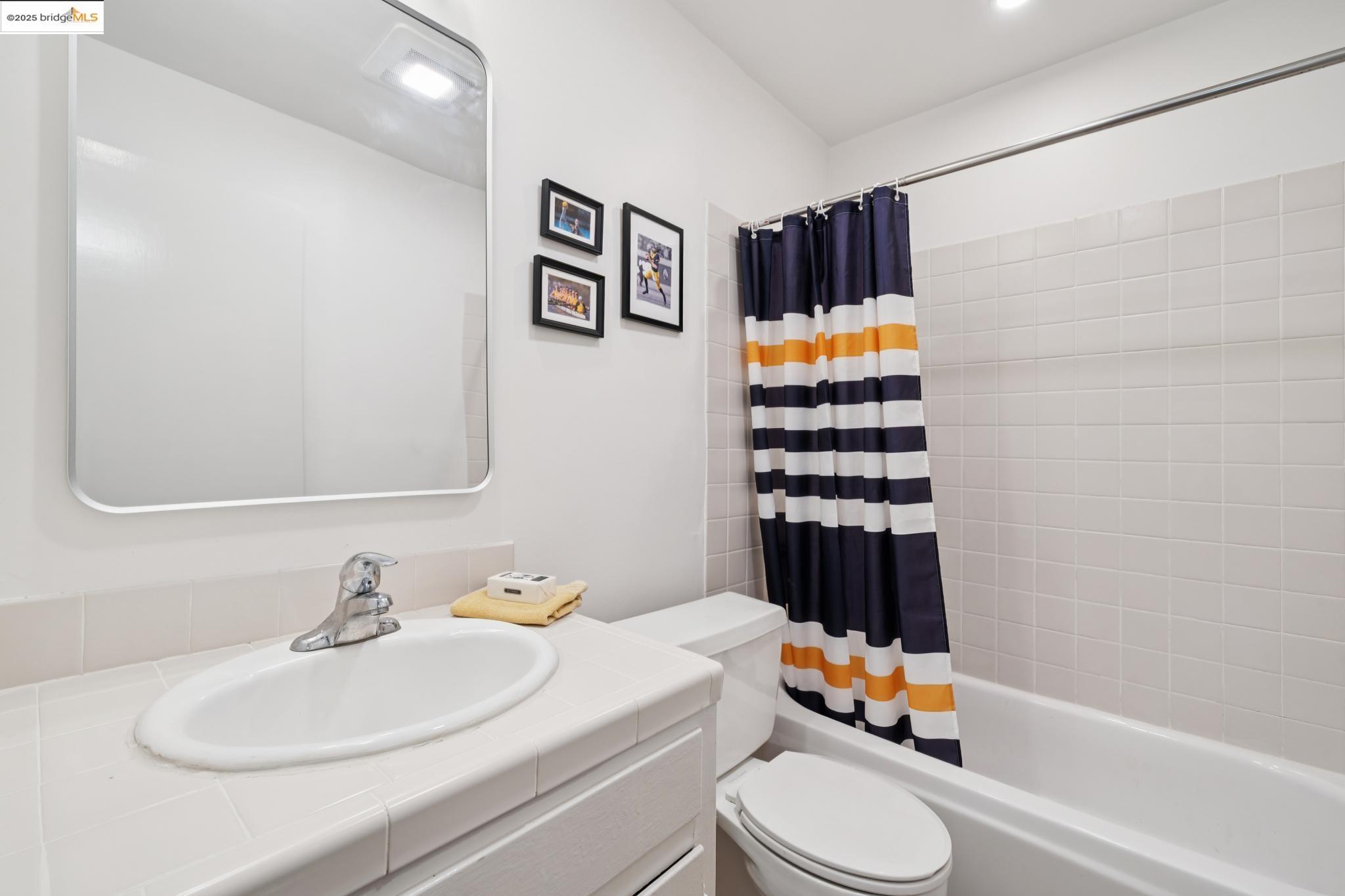 2 Panoramic Way, Unit 105 Berkeley, CA 94704 - Photo 15 of 20 a bathroom with a sink toilet and shower