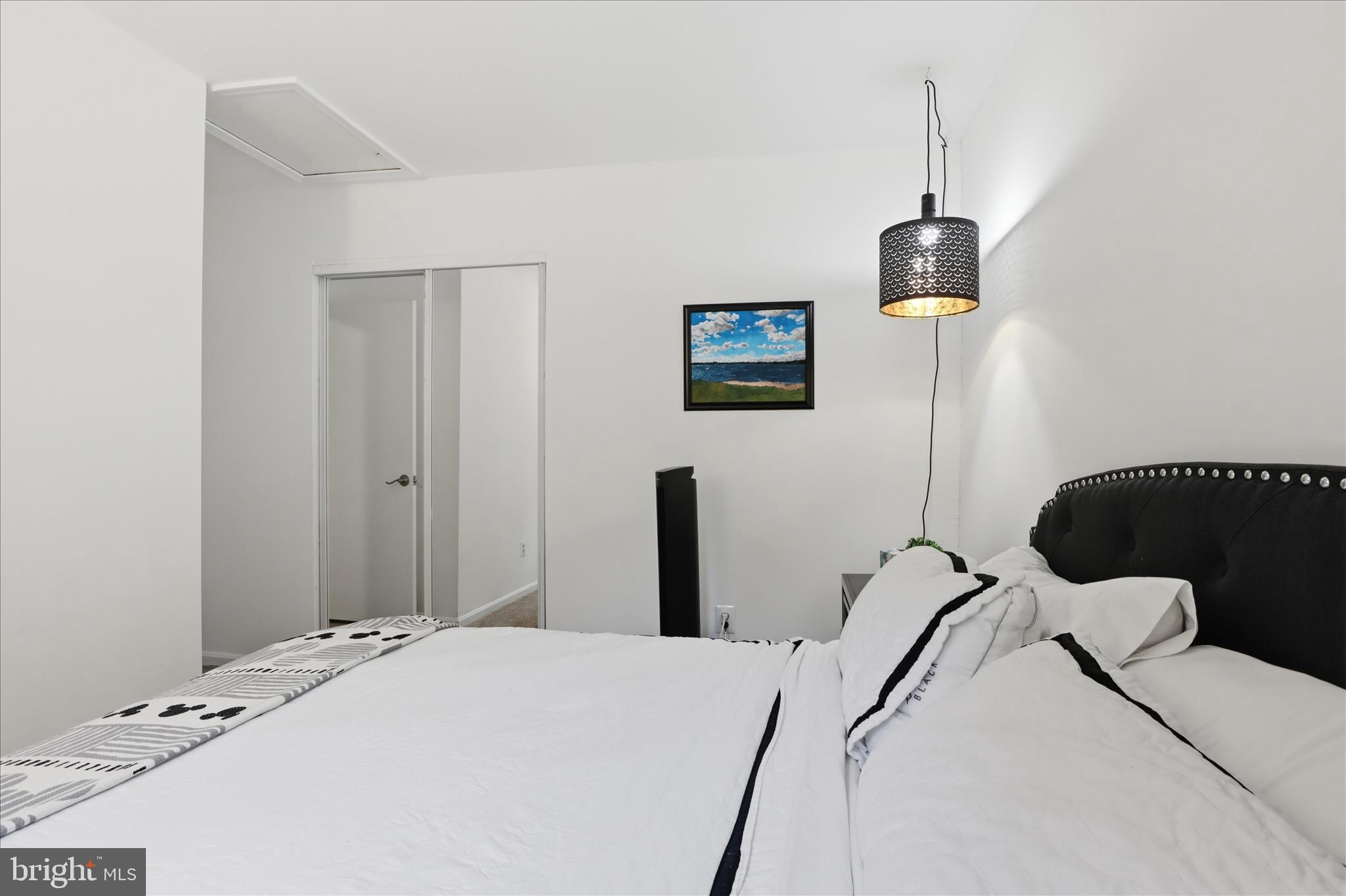 71 Kinsman View Circle Silver Spring, MD 20901 - Photo 21 of 42 a bedroom with a bed and a tv