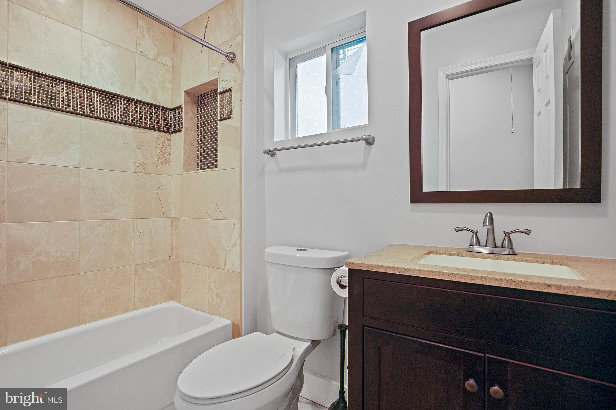 2012 2nd Street Northwest Washington, DC 20001 - Photo 8 of 9 a bathroom with a sink a toilet and a mirror