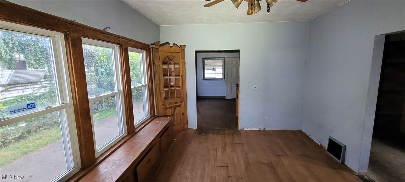 6816 Rathbun Avenue Cleveland, OH 44105 - Photo 4 of 10 Doorway featuring dark hardwood / wood-style floors and ceiling fan