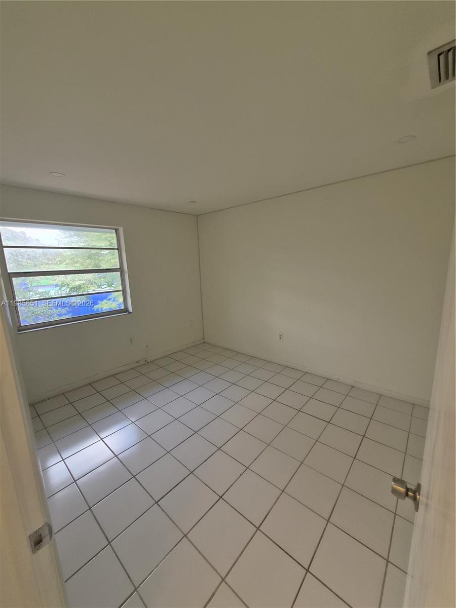 15421 Southwest 81st Cir Lane, Unit 24 Miami, FL 33193 - Photo 5 of 7 a view of a room that has a window in it