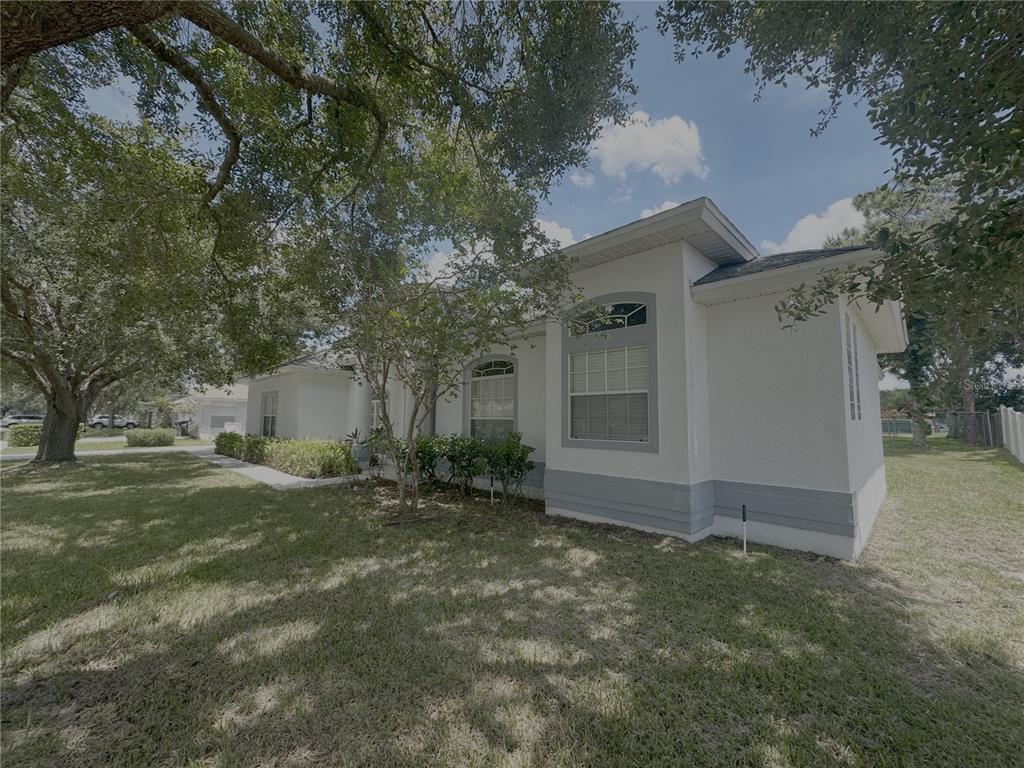 2797 Babbitt Avenue Orlando, FL 32833 - Photo 2 of 10 a front view of a house with a yard