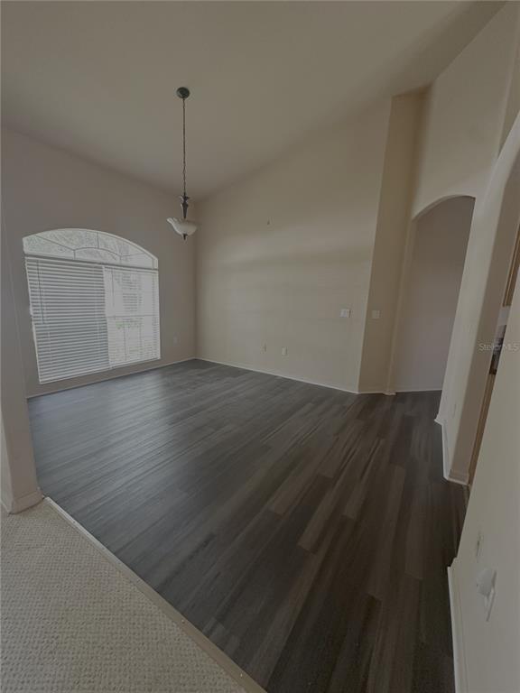 2797 Babbitt Avenue Orlando, FL 32833 - Photo 6 of 10 an empty room with wooden floor and windows