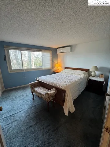 a bed sitting in a room next to a window