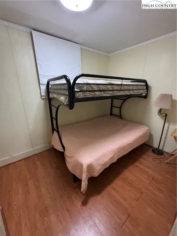 a bed sitting in a room next to a window