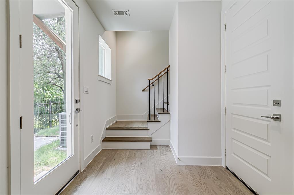 6028 Lewis Street, Unit 202 Dallas, TX 75206 - Photo 11 of 37 a view of entryway with stairs and wooden floor