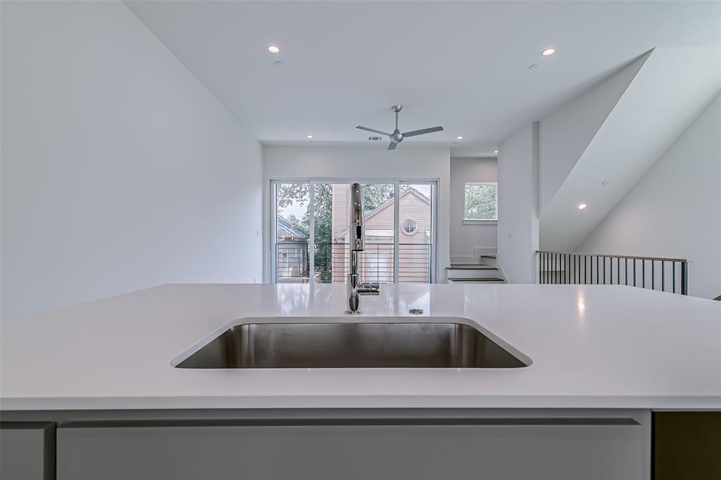 6028 Lewis Street, Unit 202 Dallas, TX 75206 - Photo 23 of 37 a view of a kitchen with a sink and large window