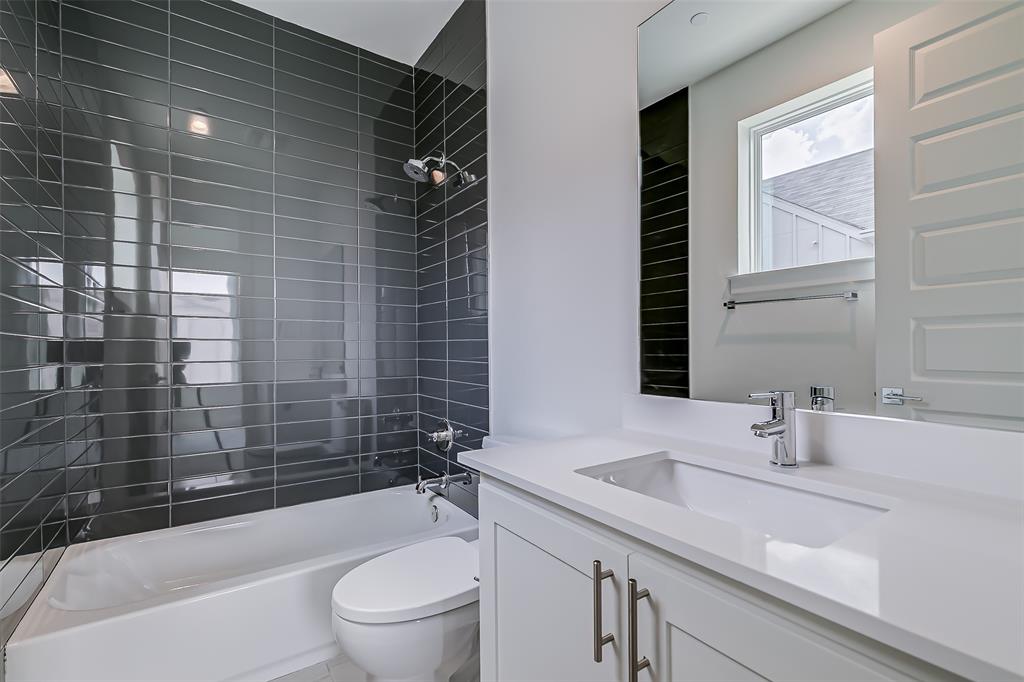 6028 Lewis Street, Unit 202 Dallas, TX 75206 - Photo 28 of 37 a bathroom with a sink a toilet and shower